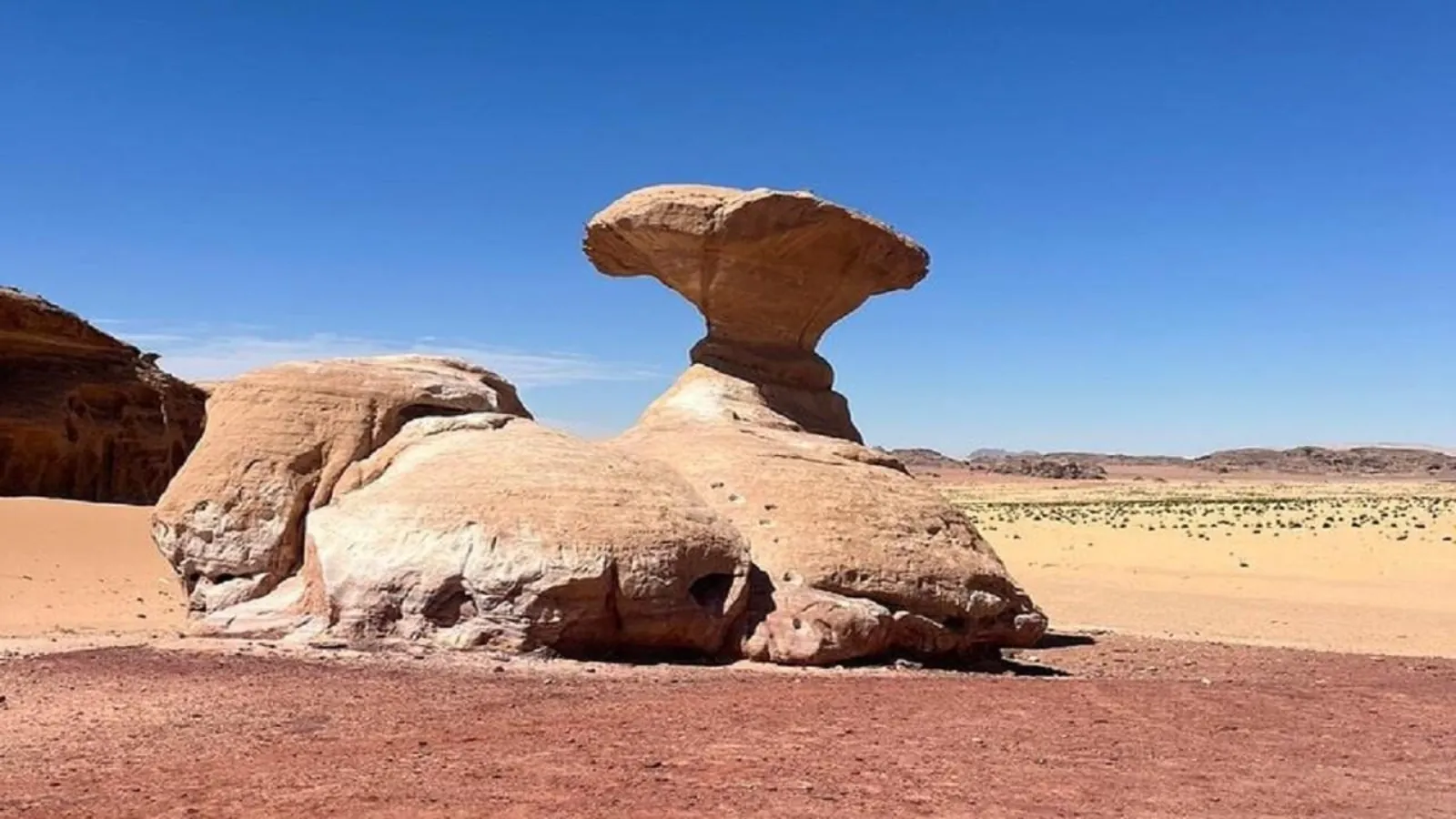 Wadi Rum's Mushroom Rock, a sandstone cap balanced on a slender stem