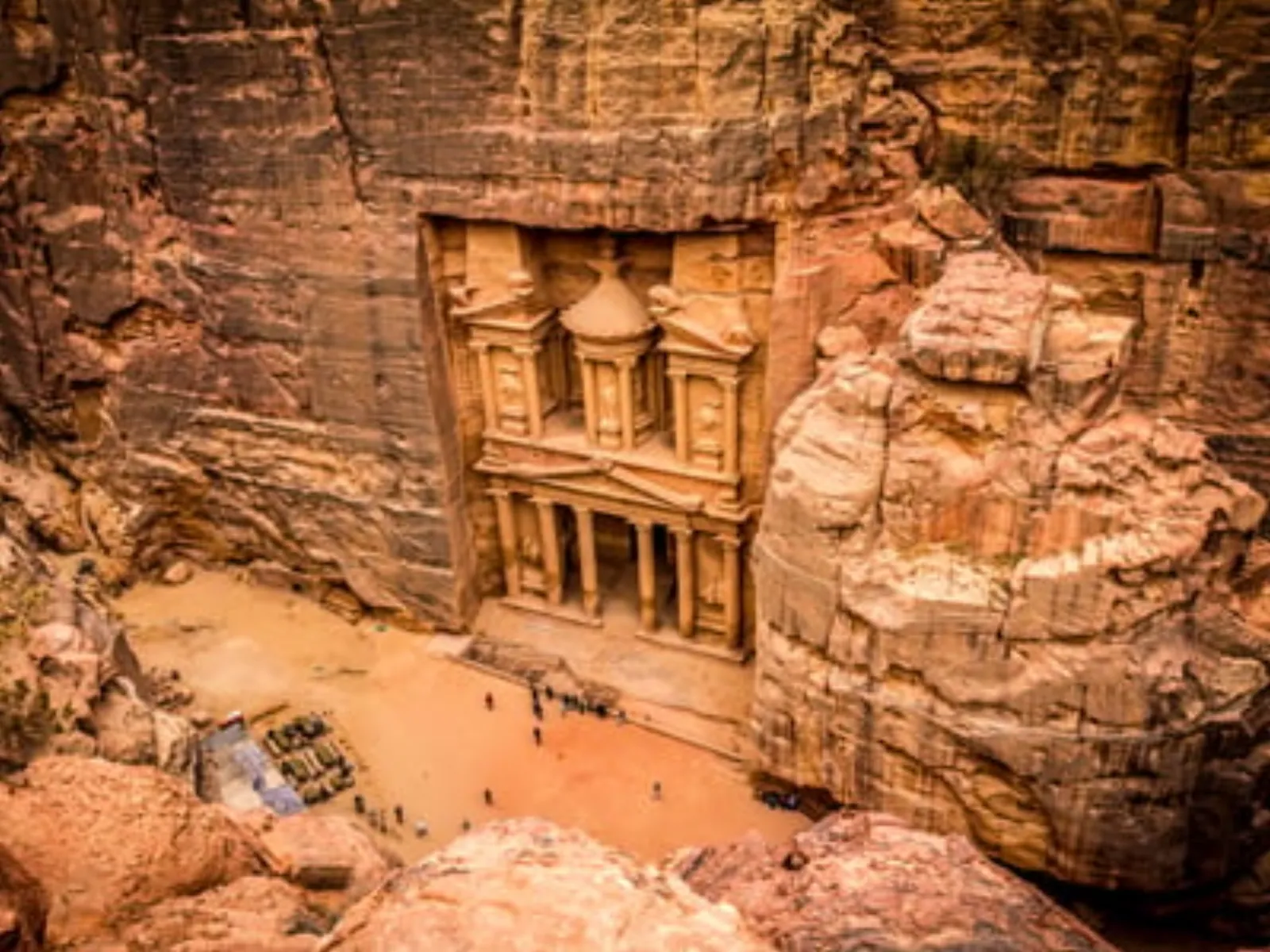 The Treasury seen from the ridge above, the Siq threading in from the left