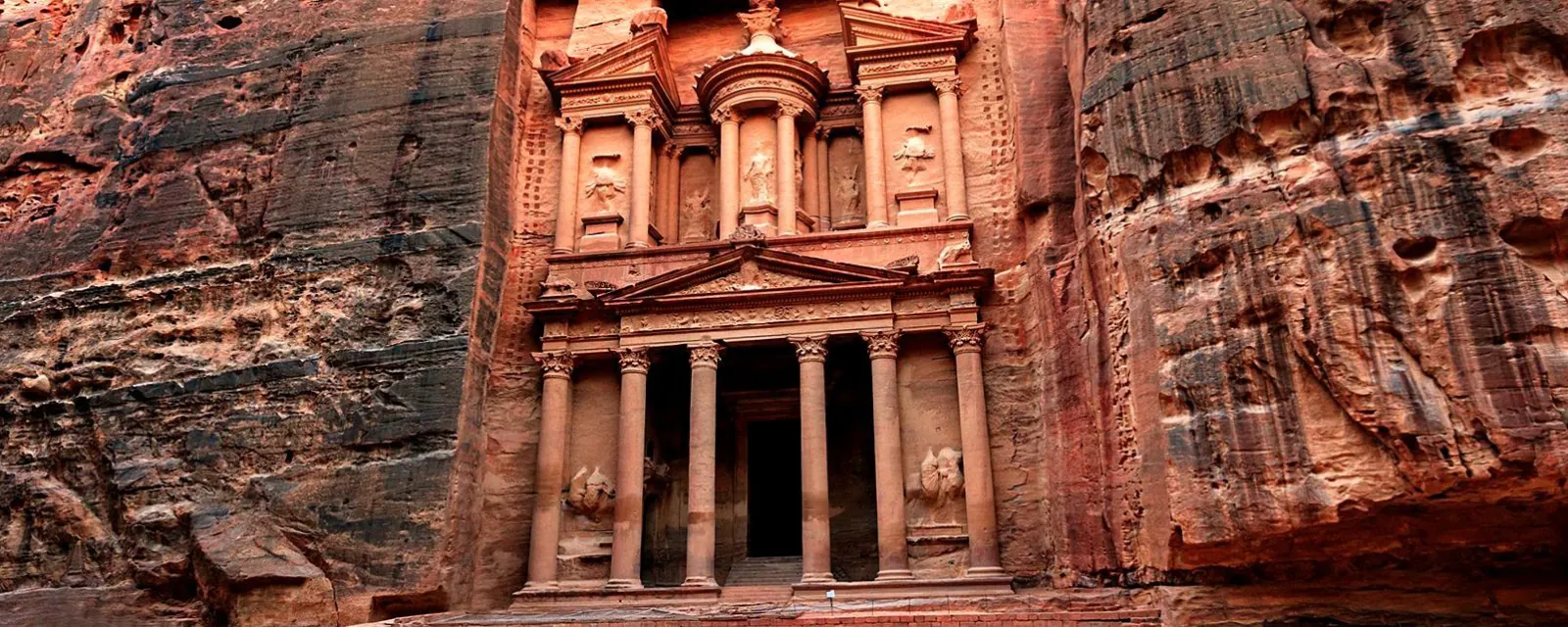 The Treasury facade with the carved walls of the Siq closing in on both sides