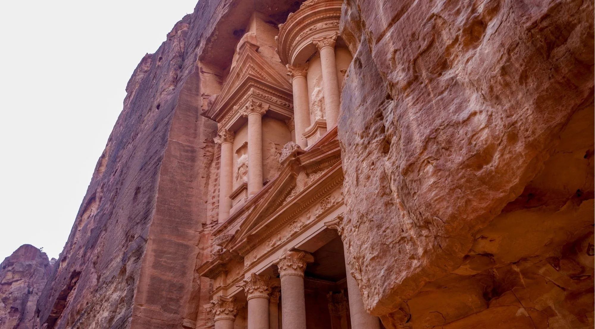 The Treasury at Petra seen from below, framed by the walls of the Siq